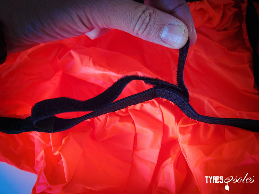 The rain cover harness attachments, to keep it secure. Pic©Tyres and Soles